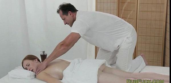  Pale redhead fucked by masseur on a table